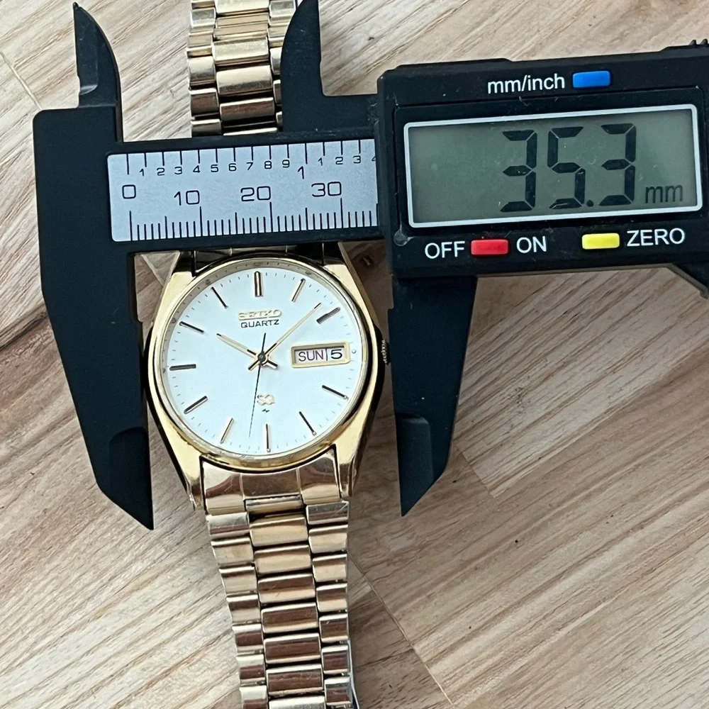 Seiko SQ Vintage Men’s Watch Silvery White Dial Gold-Tone Bracelet Date Window